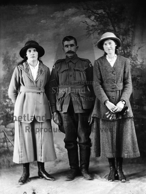 Two women and soldier