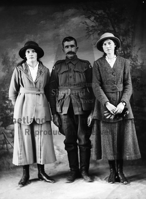 Two women and  soldier