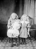 Two girls with doll