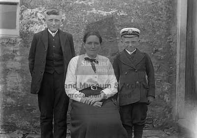 Family group- woman sitting with two boys