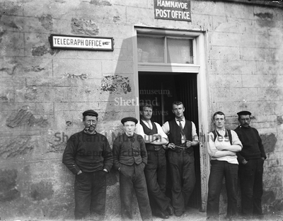 Group of men outside Hamnavoe Post Office