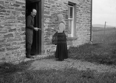 Rev. Scott in doorway of manse at Graemsay, Orkney