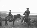 Two boys on horseback