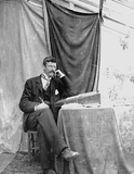 Man seated at writing desk