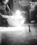 Woman bathing a baby