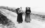 Two women carrying kishies