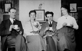 Four people drinking tea