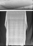 Lace shawl on stretcher