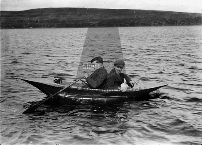 Two men in canvas boat