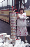 Woman with tins of sweeties