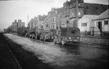 Army trucks and car at St. Olaf Street