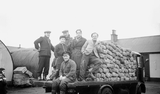 Group with torches on lorry