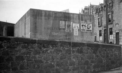 Election posters on air raid shelter, Harbour St