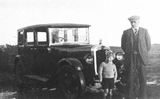 Man and Boy with Car